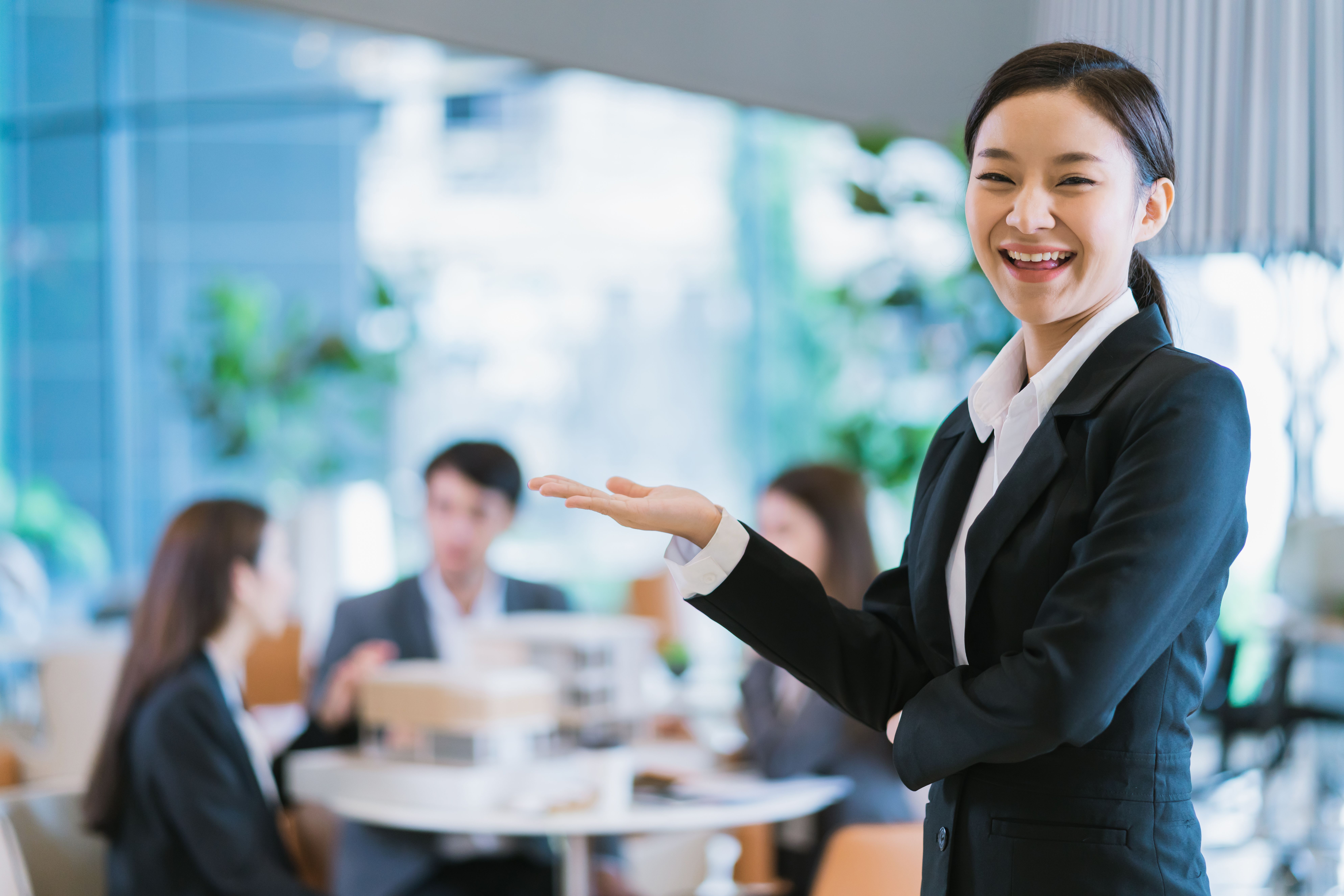 portrait-close-up-smart-attractive-asian-business-female-smile-with-confident-leadership-modern-office-background.jpg